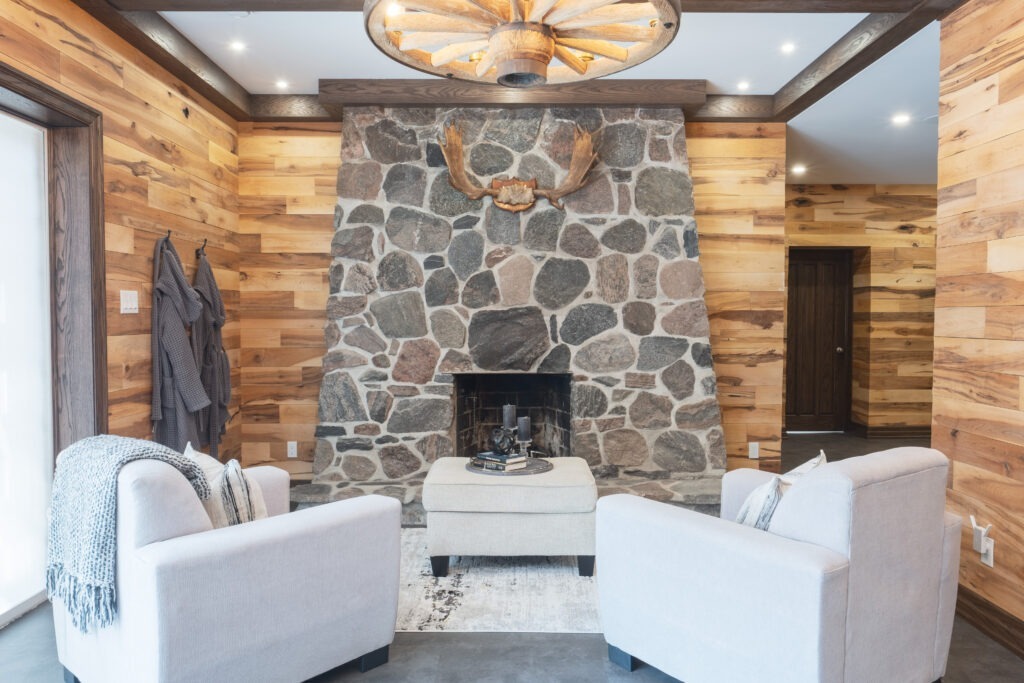 Rustic basement grandroom natural stone fireplace