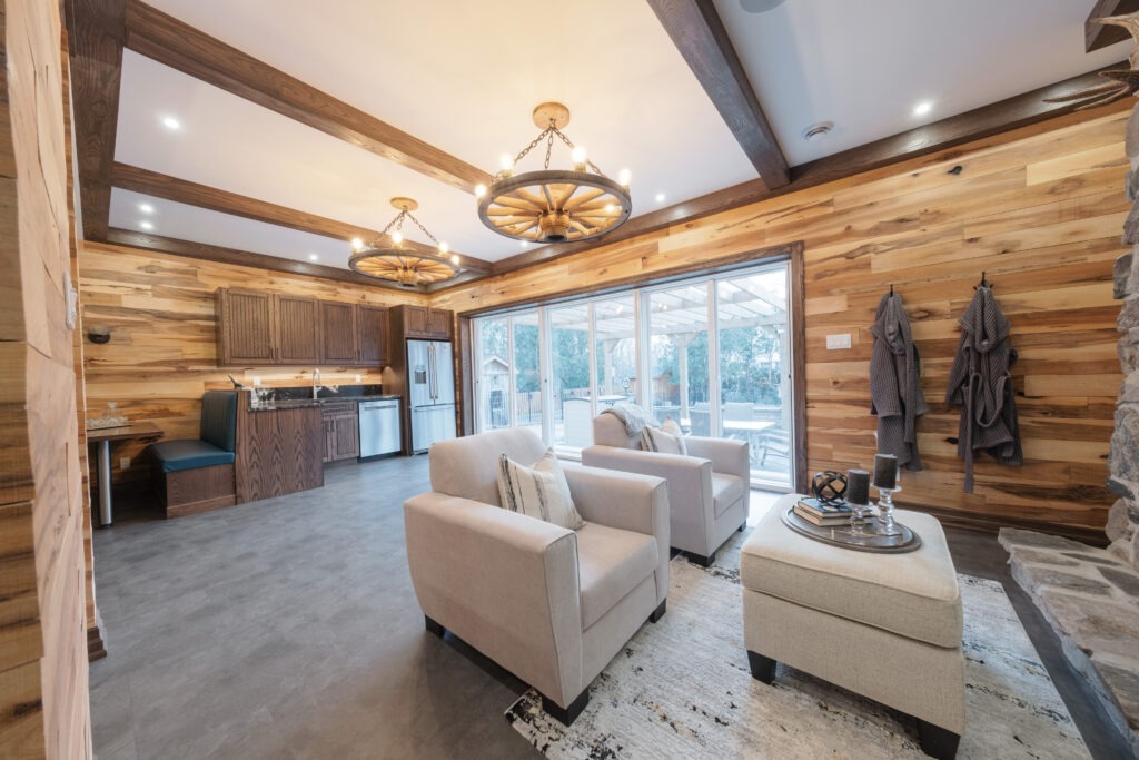 Rustic basement grandroom with kitchenette, dining booth and bar