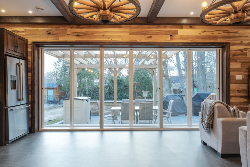 Rustic basement grand room, natural light window wall